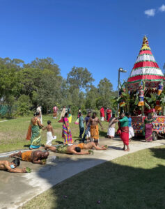 Men roll behind the chariot to complete vratas or religious vows to their gods, 2021.