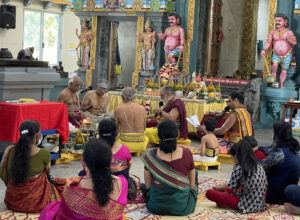 Priests conduct a fire ritual at the Sri Selva Vinayakar Koyil, 2021.