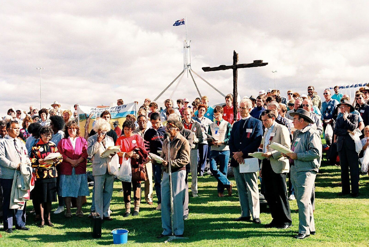 Figure 3: Rev. Charles Harris speaks at a 1988 Bicentennial protest, Parliament House Canberra (Uniting Church in Australia, Queensland Synod; Creative Commons).