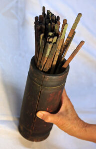 Figure 10: Divination blocks and sticks. Bamboo tubes containing fortune sticks are used as part of the divination process (Gordon Grimwade).