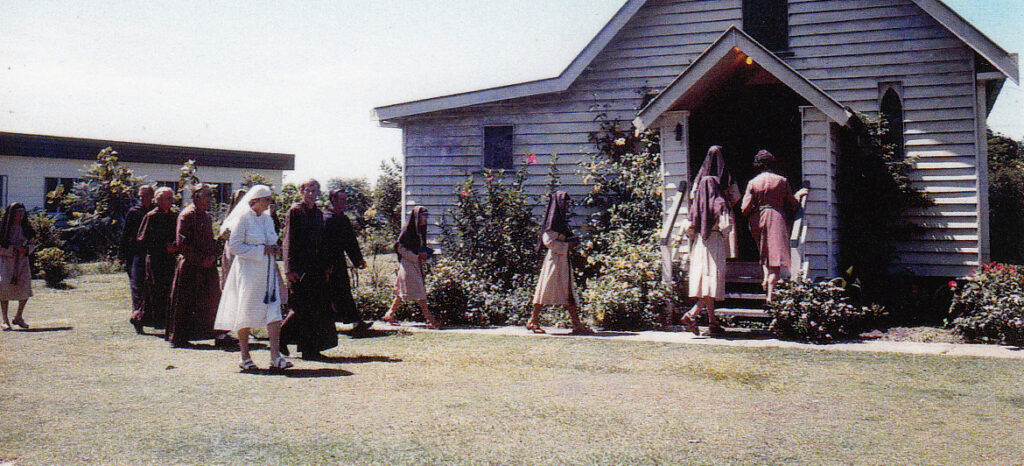 Figure 3: Members of the Confraternity of the Kingdom of Christ in procession, New Barnet, c. early 1940s (Abbey Museum).